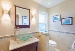 The full guest bathroom is located off the living room and provides lots of extra space for geusts